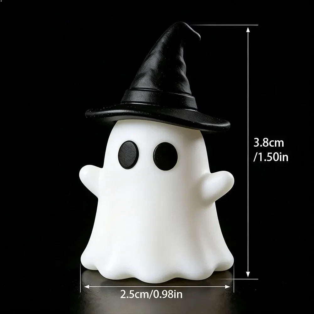 Halloween-themed desktop decoration scene - cute little ghosts, decorative items, mini glowing micro-landscape